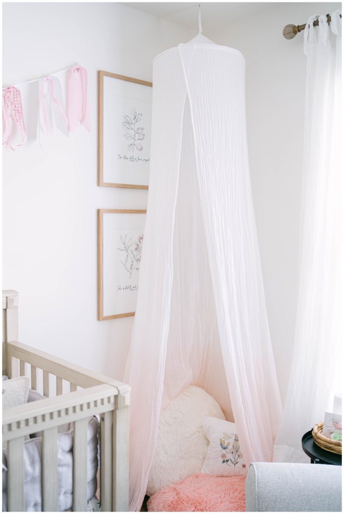 A sheer fabric falls around a comfy spot in a nursery. Alpharetta Newborn Photographer Grace Emily documents important personal touches in a nursery.