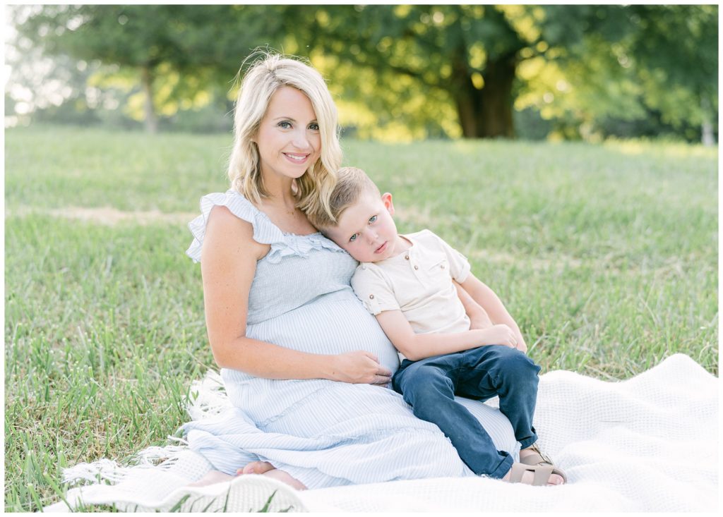 A pregnant mother and son gaze into the camera. Atlanta maternity photographer Grace Emily Photography captures how to involve siblings in maternity photos.