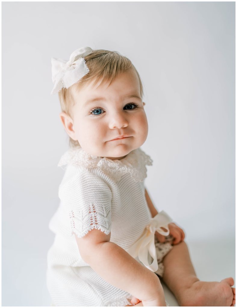 A sweet baby girl smiles during her milestone session. Studio Photo Session, Grace Emily Photography, Alpharetta Photographer
