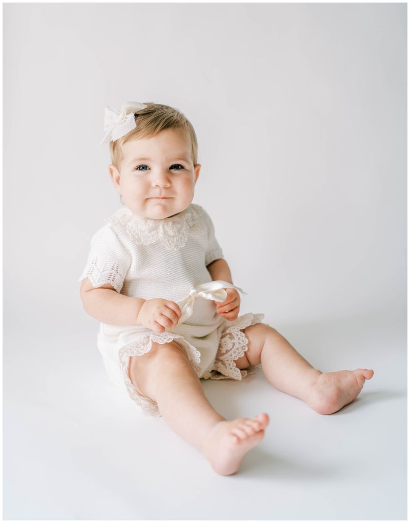 A baby smiles during their milestone session. Studio Photo Session, Grace Emily Photography, Alpharetta Photographer
