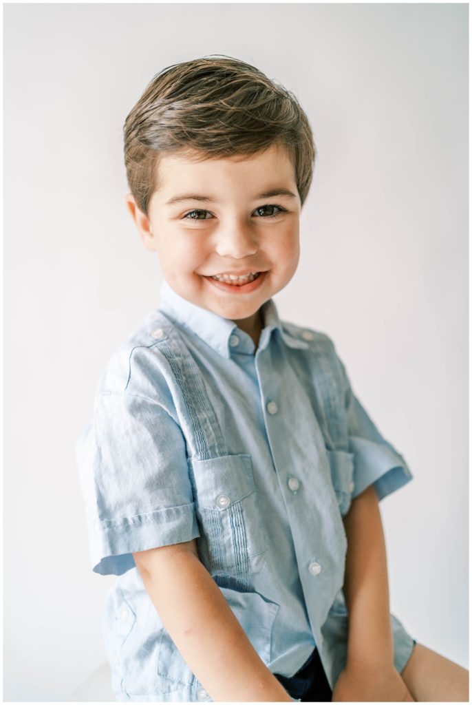 A boy smiles at the camera. Alpharetta Milestone session, Alpharetta photographer