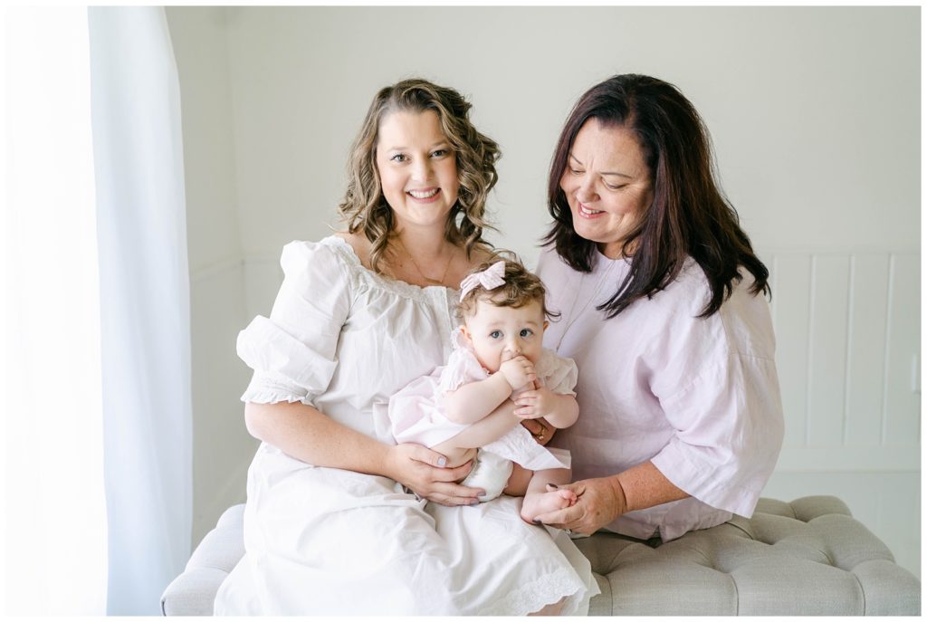 Grandma, Mom, and daughter embrace - Milton, Georgia Six-Month Milestone Session by Grace Emily Photography