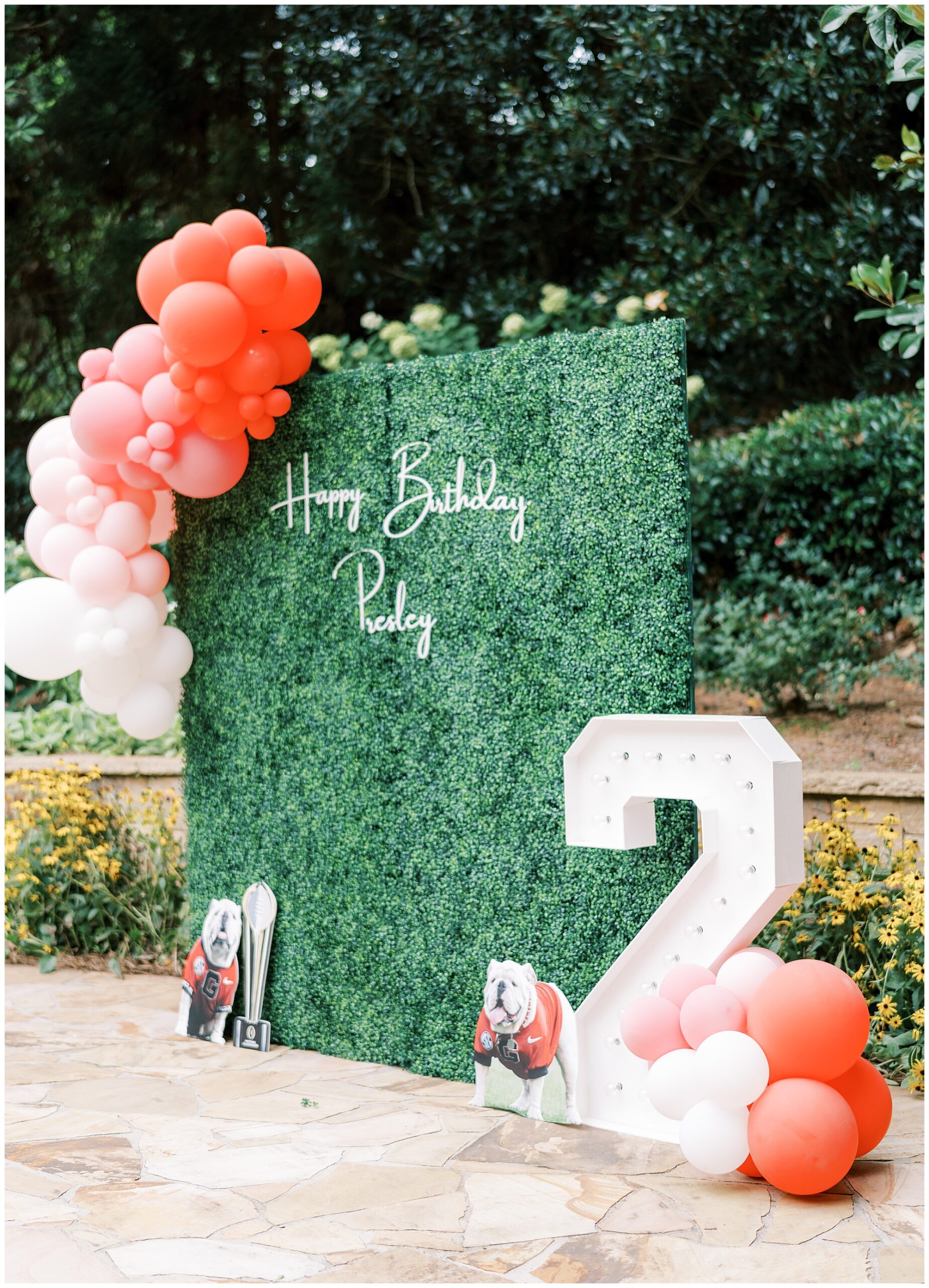 UGA themes birthday party with boxwood wall and large 2.
