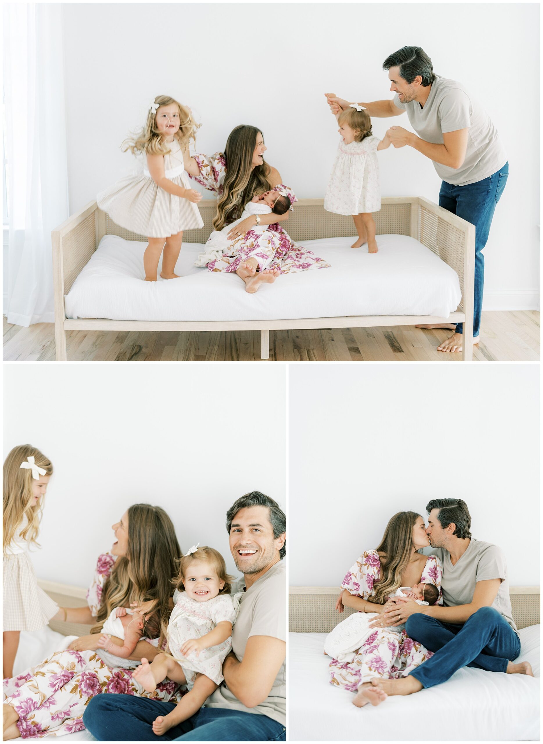 A portrait of parents with a newborn girl and their toddlers jumping on a daybed during a Roswell newborn session.