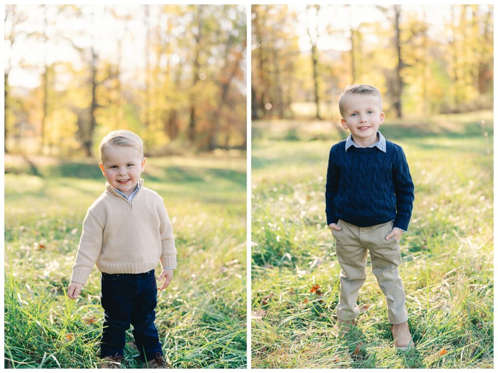 Atlanta fall mini session of two children in a field of green grass lines by trees with yellow, red, and orange foliage by Grace Emily Photography.