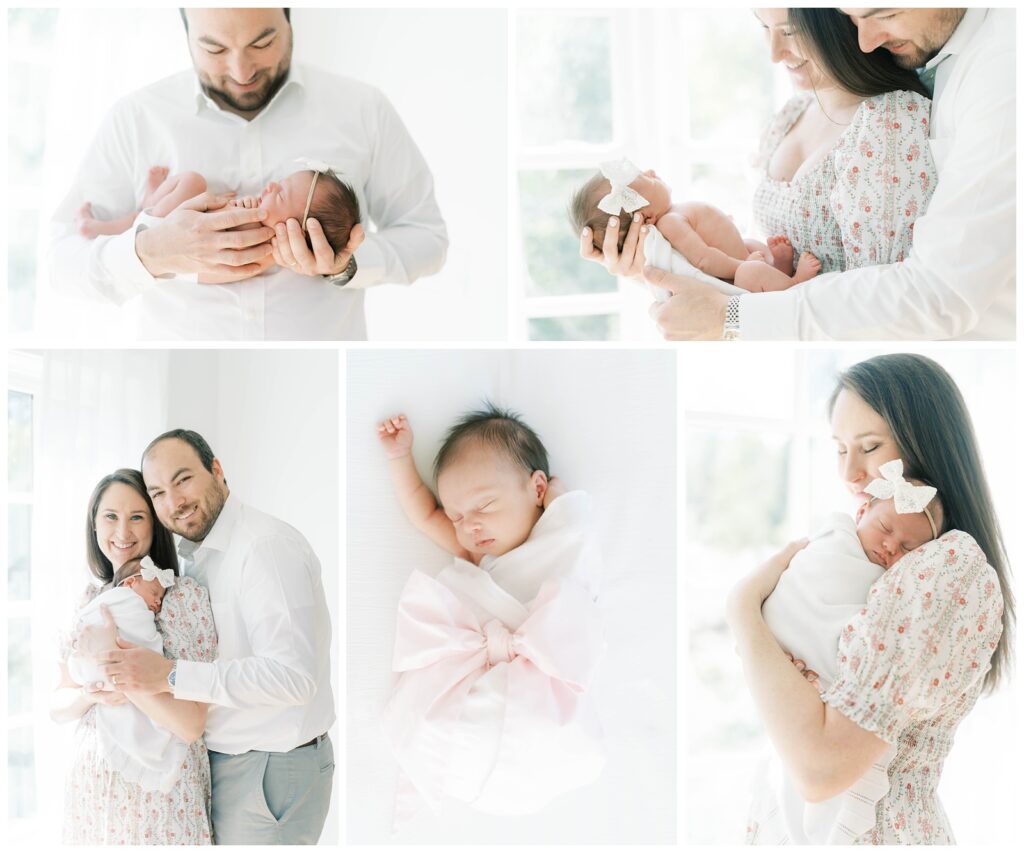 A collection of five images of a newborn baby girl being held by her parents. The baby girl is wearing a white swaddle & a white bow. She has dark black hair. 